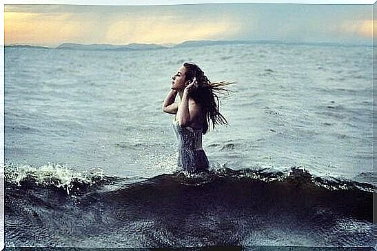 the woman looks at each property of the water