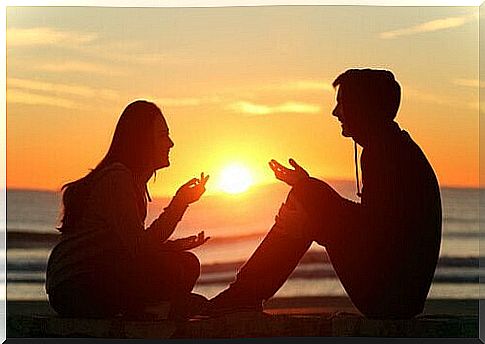 couple chatting on the beach