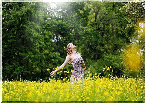 a woman in nature feels peace