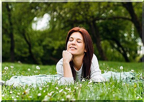 Satisfied woman in the park