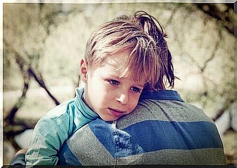 boy on father's shoulder