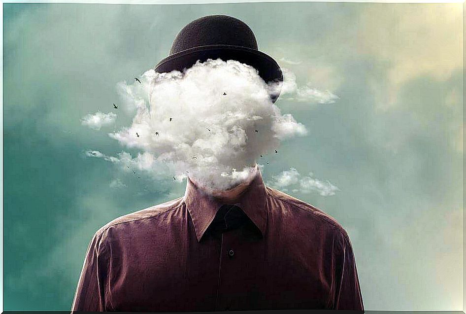 the man's face is covered with a cloud