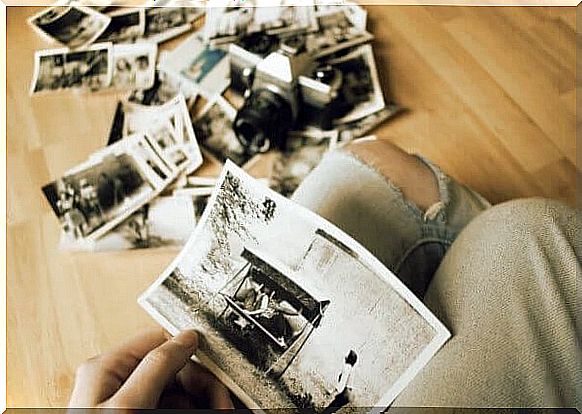 woman looking at old photos