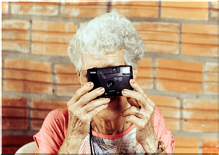 grandma takes a picture with the camera