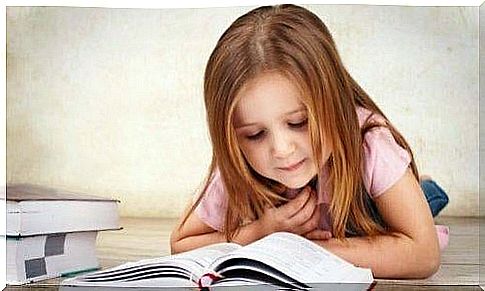 little girl reading a book