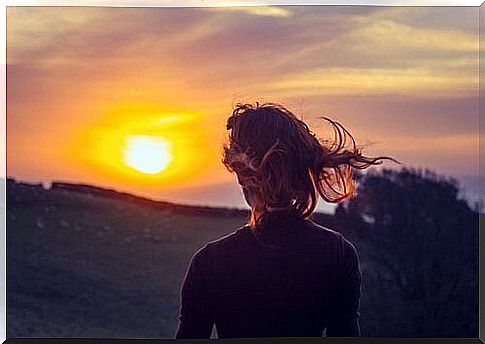 woman watching the sun