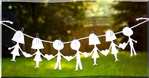 paper dolls hanging on wire