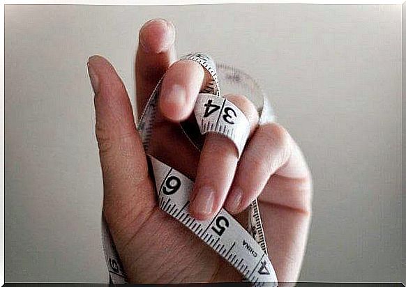 measuring tape in hand